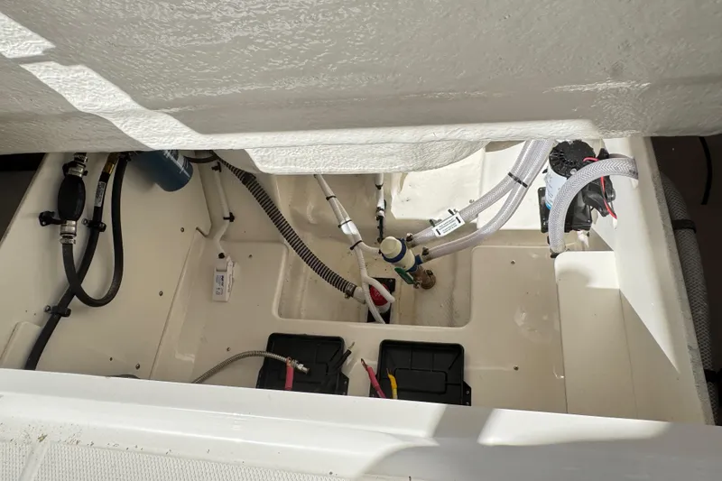 Slide: The Image of 2026 Robalo R230 Center Console boat interior wiring and plumbing details. - 26