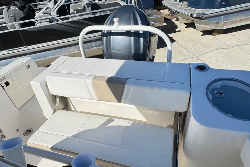 Slide: The Image of 2026 Robalo R230 Center Console boat interior with seating and cup holder. - 27