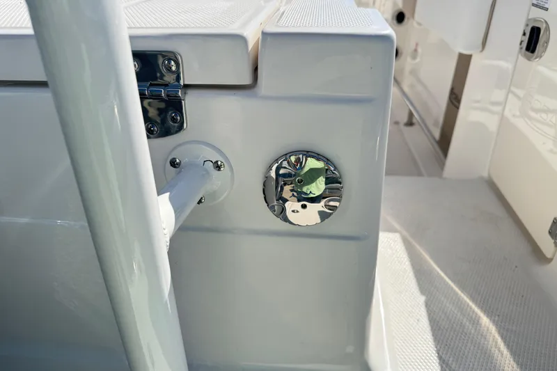 Slide: The Image of 2026 Robalo R230 Center Console boat detail with chrome fittings and white deck. - 7