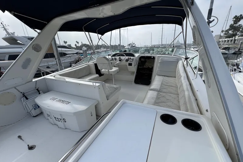 Slide: The Image of 1998 Bayliner 4788 Pilot House Motoryacht helm with steering wheel and control panel. - 14