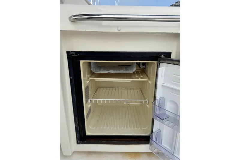 Slide: The Image of 1998 Bayliner 4788 Pilot House Motoryacht interior with sink and seating area. - 16