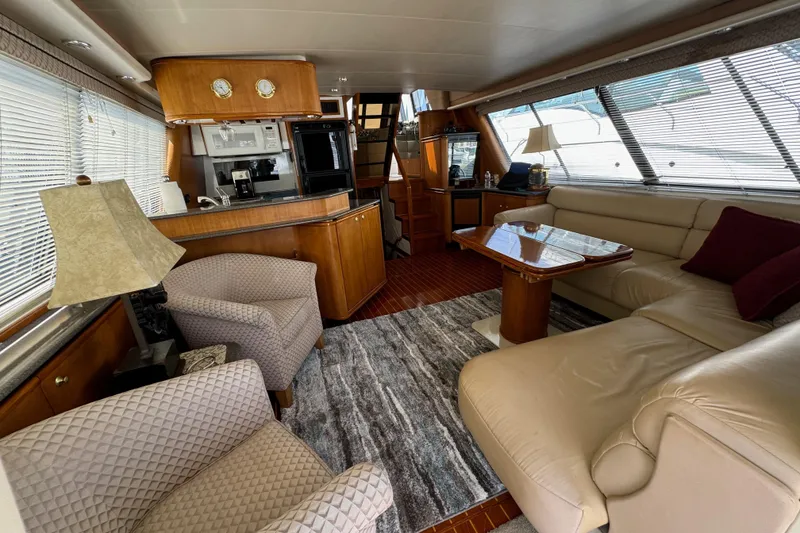 Slide: The Image of Luxurious interior of 1998 Bayliner 4788 Pilot House Motoryacht with elegant furnishings. - 20