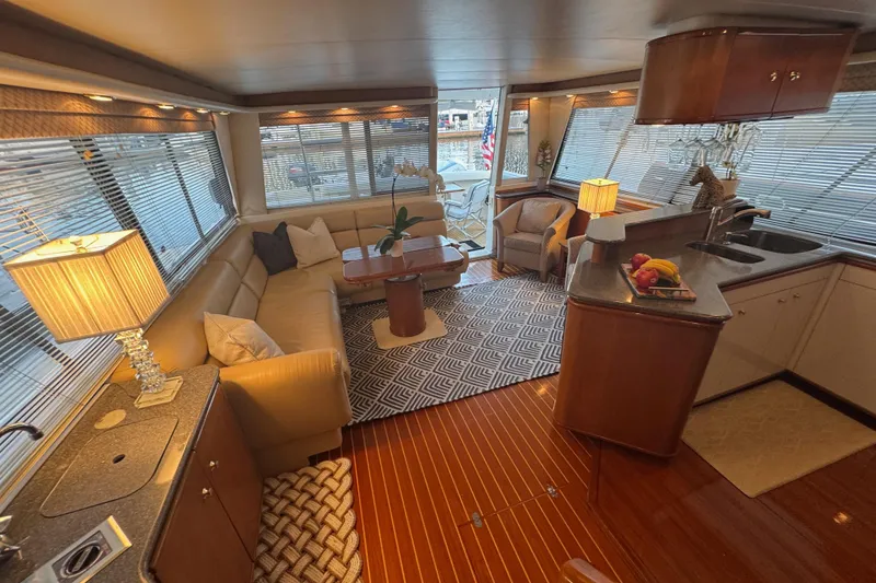 Slide: The Image of Luxurious interior of 1998 Bayliner 4788 Pilot House Motoryacht with elegant furnishings and modern kitchen. - 24
