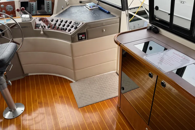 Slide: The Image of 1998 Bayliner 4788 Pilot House Motoryacht interior with cozy bunk beds and wooden cabinetry. - 37