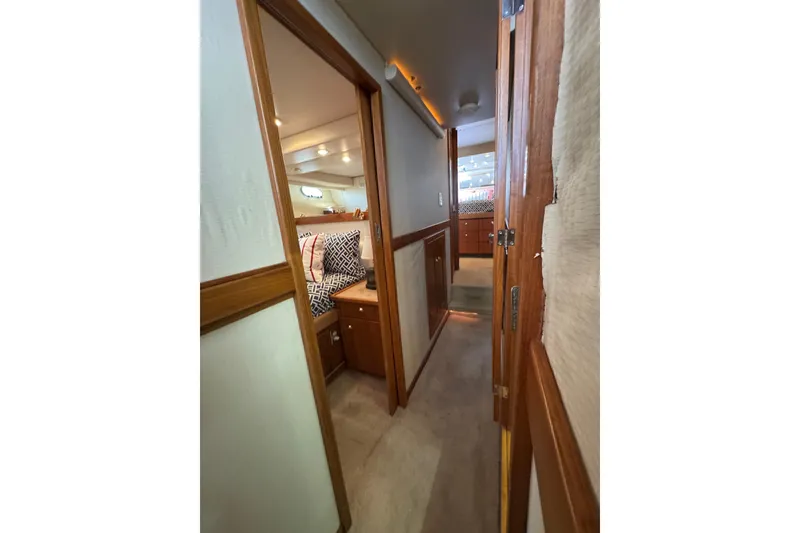 Slide: The Image of 1998 Bayliner 4788 Pilot House Motoryacht interior with bunk beds and mirrored closet. - 41