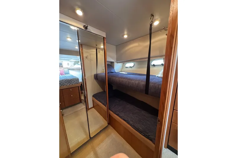 Slide: The Image of Cozy bunk beds in 1998 Bayliner 4788 Pilot House Motoryacht cabin interior. - 42