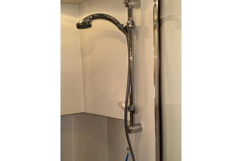 Slide: The Image of 1998 Bayliner 4788 Pilot House Motoryacht engine room with starboard and port engines visible. - 53