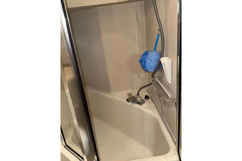 Slide: The Image of Engine room of 1998 Bayliner 4788 Pilot House Motoryacht, showcasing complex piping and machinery. - 54