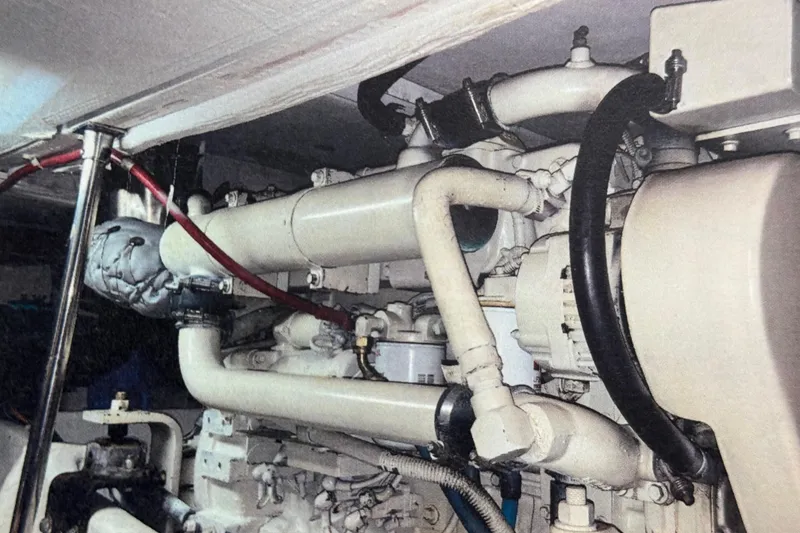 Slide: The Image of Luxurious interior of 1998 Bayliner 4788 Pilot House Motoryacht with elegant seating and kitchen area. - 56