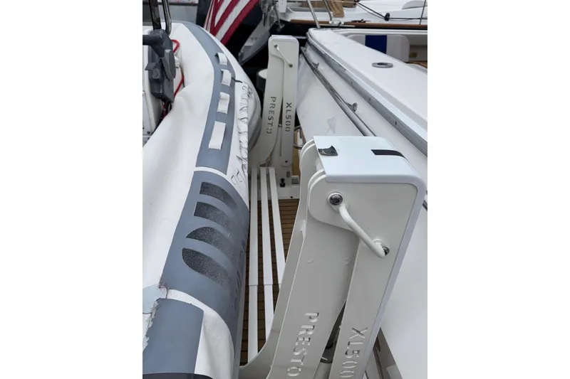 Slide: The Image of 1998 Bayliner 4788 Pilot House Motoryacht with dinghy and Yamaha motor at marina. - 6