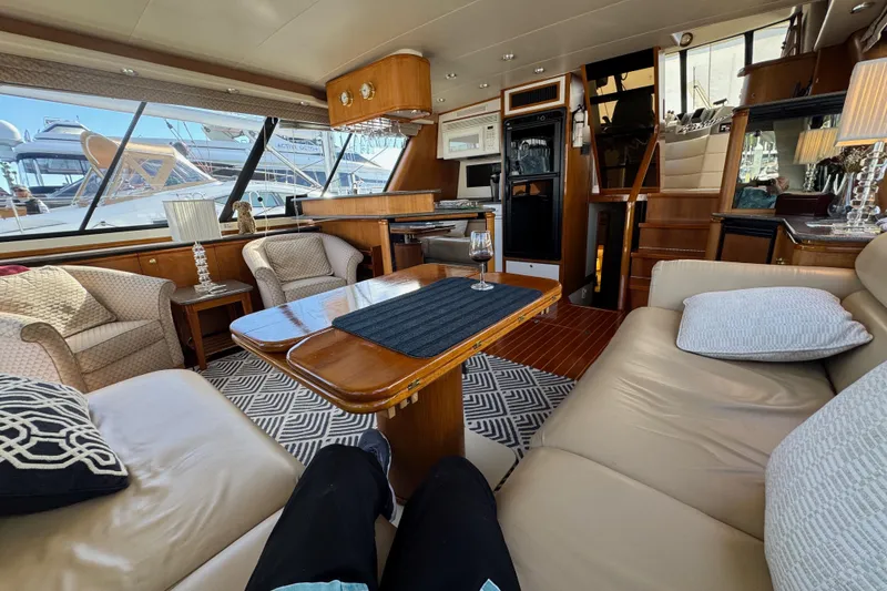 Slide: The Image of Luxurious interior of 1998 Bayliner 4788 Pilot House Motoryacht with elegant seating and decor. - 61