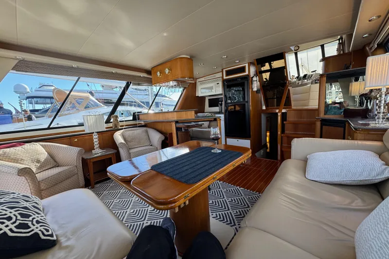 Slide: The Image of Luxurious interior of a 1998 Bayliner 4788 Pilot House Motoryacht with elegant furnishings. - 62