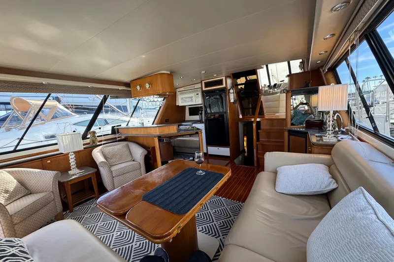 Slide: The Image of Luxurious interior of 1998 Bayliner 4788 Pilot House Motoryacht with elegant furnishings. - 65