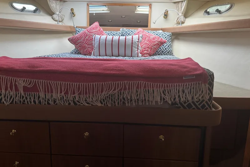 Slide: The Image of Cozy bedroom in 1998 Bayliner 4788 Pilot House Motoryacht with stylish bedding and decor. - 66
