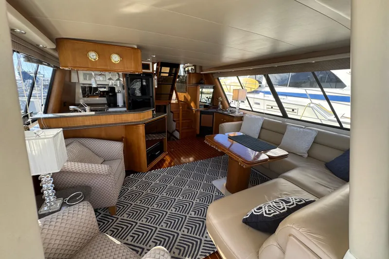 Slide: The Image of Luxurious interior of 1998 Bayliner 4788 Pilot House Motoryacht with elegant seating and decor. - 68