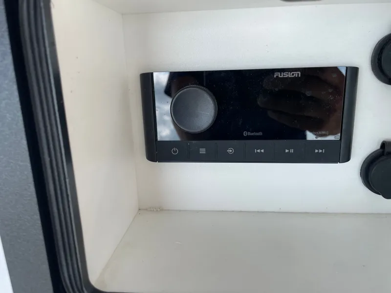 Slide: The Image of Fusion Bluetooth audio system in 2024 NauticStar 191H boat. - 14