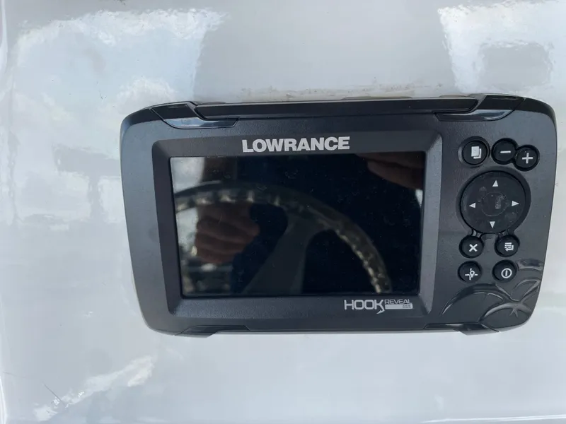 Slide: The Image of Lowrance Hook Reveal 5SS fish finder on 2024 NauticStar 191H boat dashboard. - 16