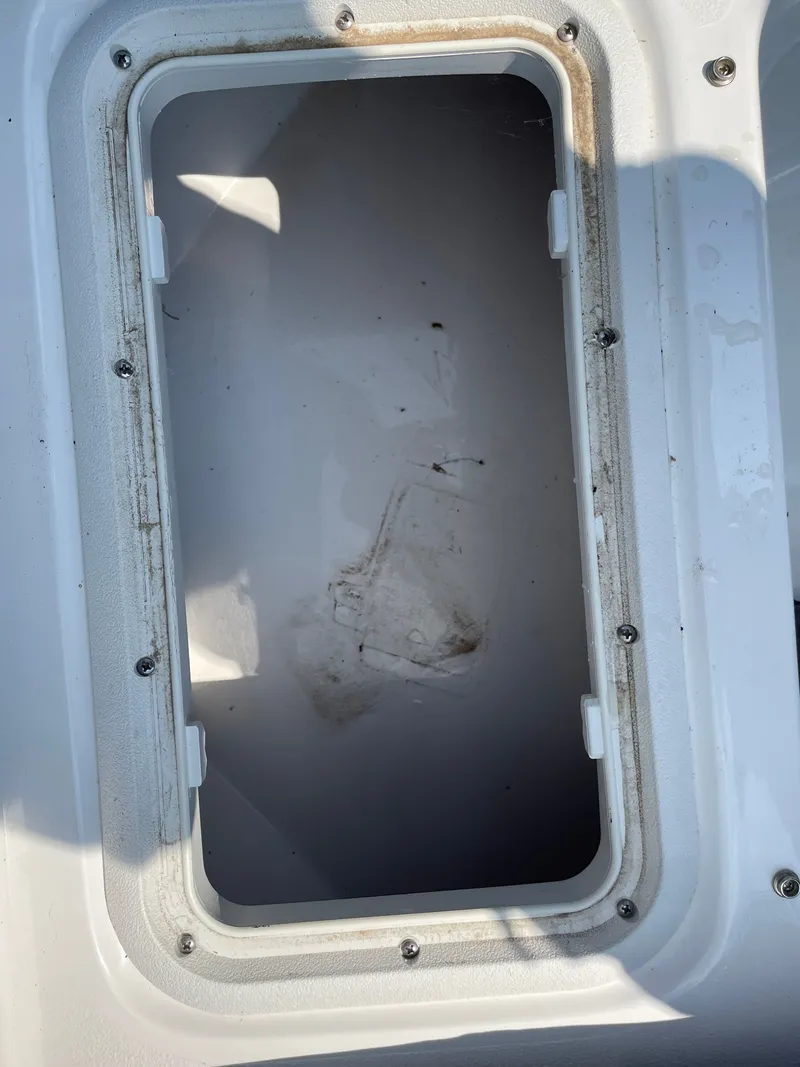 Slide: The Image of Open storage compartment on 2024 NauticStar 191H boat, showing interior details. - 23