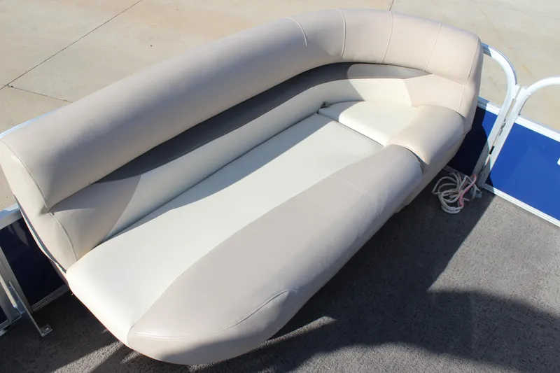 Slide: The Image of 2016 Sun Tracker Party Barge 16 DLX seating area with beige upholstery. - 10