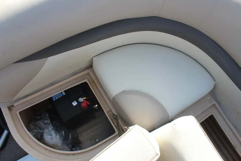 Slide: The Image of 2016 Sun Tracker Party Barge 16 DLX seating with storage compartment and battery. - 17