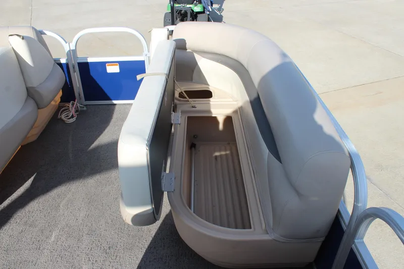 Slide: The Image of 2016 Sun Tracker Party Barge 16 DLX with open storage compartment on deck. - 20