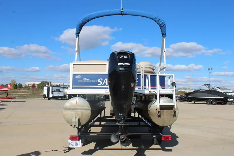 Slide: The Image of 2016 Sun Tracker Party Barge 16 DLX pontoon boat with 75 HP engine, parked outdoors. - 6