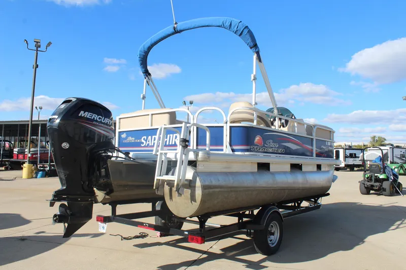 Slide: The Image of 2016 Sun Tracker Party Barge 16 DLX pontoon boat on trailer, with Mercury outboard motor. - 7