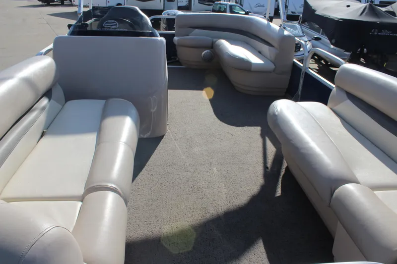 Slide: The Image of 2016 Sun Tracker Party Barge 16 DLX interior with spacious seating and helm. - 8