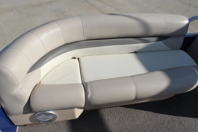 Slide: The Image of 2016 Sun Tracker Party Barge 16 DLX, beige seating with speaker detail. - 9