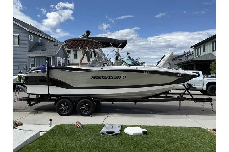 Slide: The Image of 2021 MasterCraft X24 boat on trailer in residential neighborhood. - 6