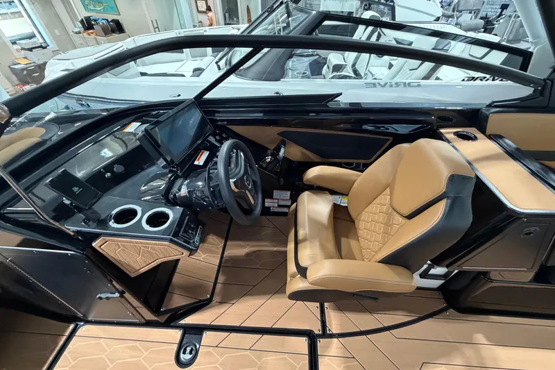 Slide: The Image of Interior of 2026 Yamaha Boats 255 XD, featuring luxurious seating and modern dashboard controls. - 11