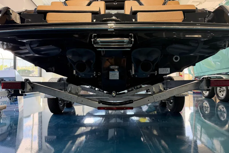Slide: The Image of 2026 Yamaha Boats 255 XD on trailer, rear view in showroom setting. - 17