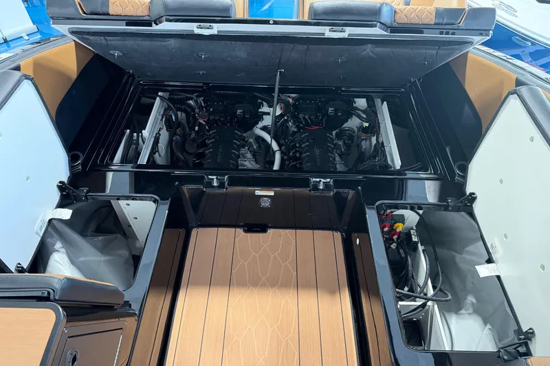 Slide: The Image of 2026 Yamaha Boats 255 XD engine compartment with open hatches and visible components. - 19