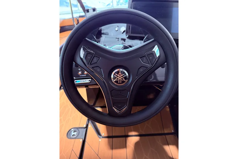 Slide: The Image of Steering wheel of 2026 Yamaha Boats 255 XD, featuring modern controls and sleek design. - 21