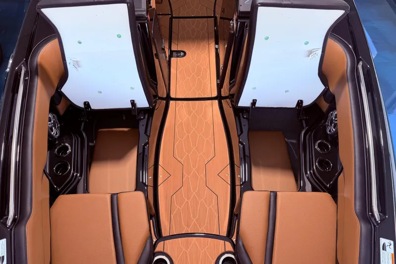Slide: The Image of Interior view of 2026 Yamaha Boats 255 XD with brown seating and sleek design. - 24