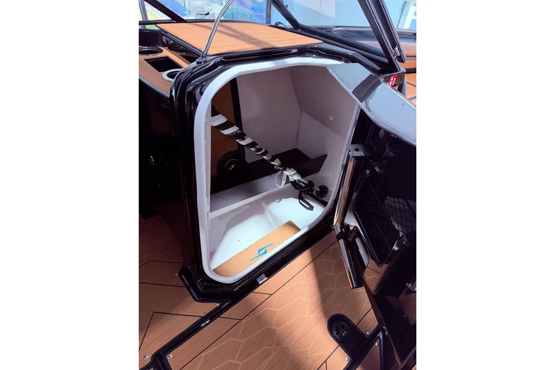 Slide: The Image of Interior view of 2026 Yamaha Boats 255 XD storage compartment with sleek design. - 25