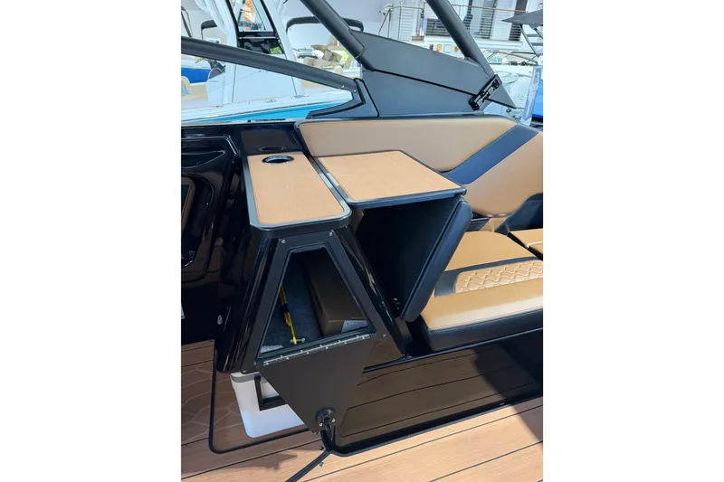 Slide: The Image of Interior view of 2026 Yamaha Boats 255 XD, featuring sleek seating and storage compartments. - 28