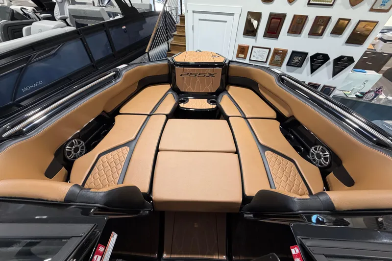 Slide: The Image of 2026 Yamaha Boats 255 XD interior with luxurious tan seating and modern design. - 6