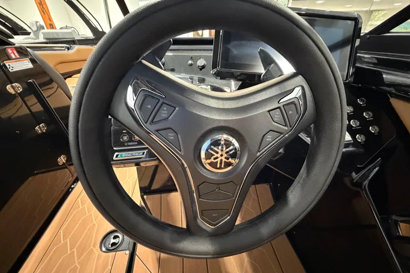 Slide: The Image of Steering wheel of 2026 Yamaha Boats 255 XD, featuring modern controls and sleek design. - 8