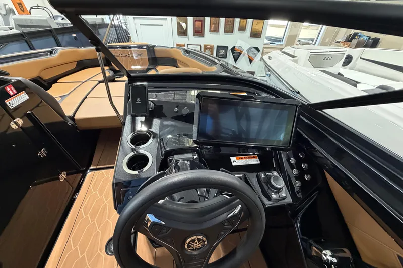 Slide: The Image of 2026 Yamaha Boats 255 XD cockpit with modern dashboard and steering wheel. - 9