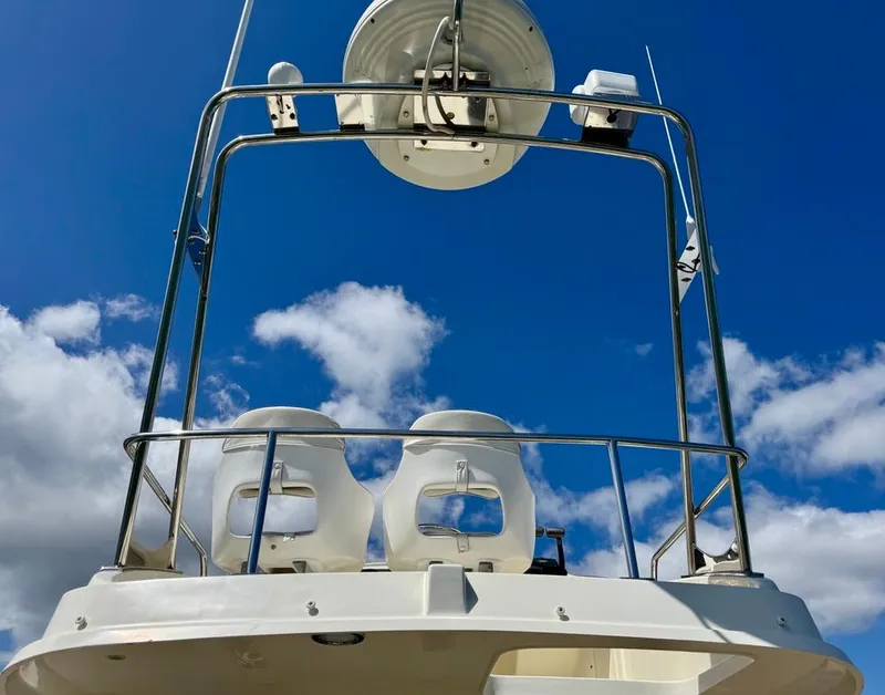 Slide: The Image of 2004 Rodman 800 boat with radar tower against a blue sky. - 10
