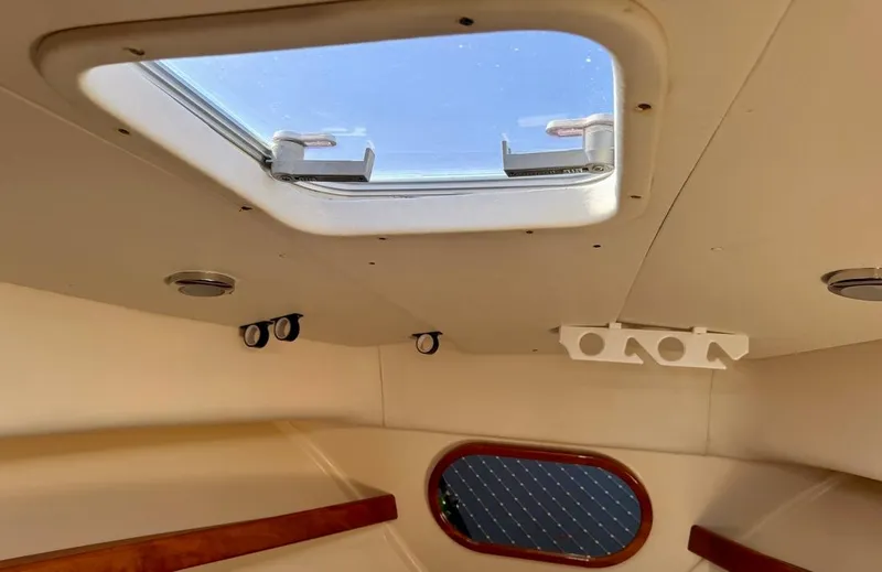 Slide: The Image of Interior view of 2004 Rodman 800 boat cabin with skylight. - 23