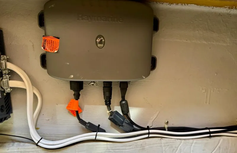 Slide: The Image of Raymarine device with cables in a 2004 Rodman 800 boat. - 38