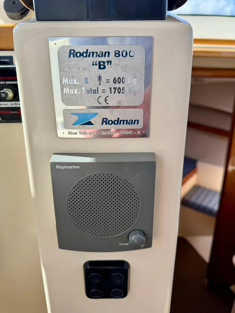 Slide: The Image of Control panel of a 2004 Rodman 800 boat with capacity specifications. - 41