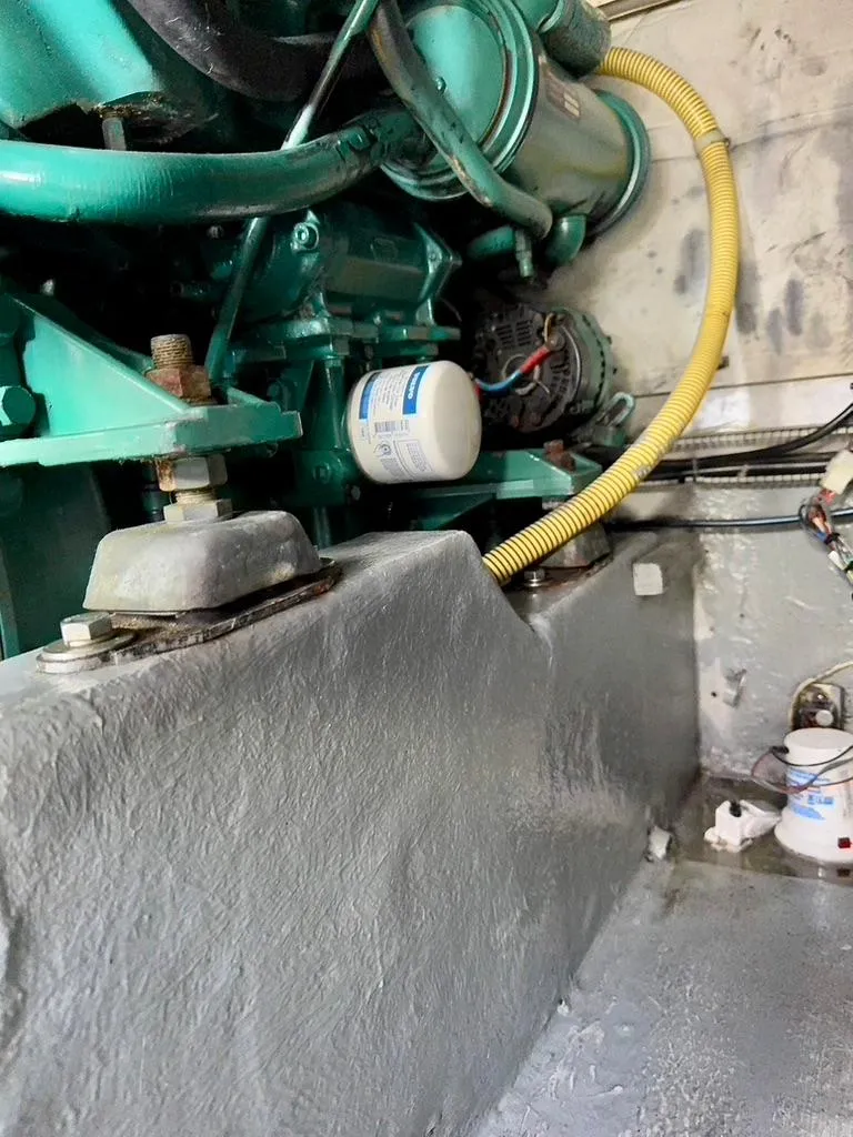 Slide: The Image of Engine compartment of a 2004 Rodman 800 boat, featuring visible components and wiring. - 48