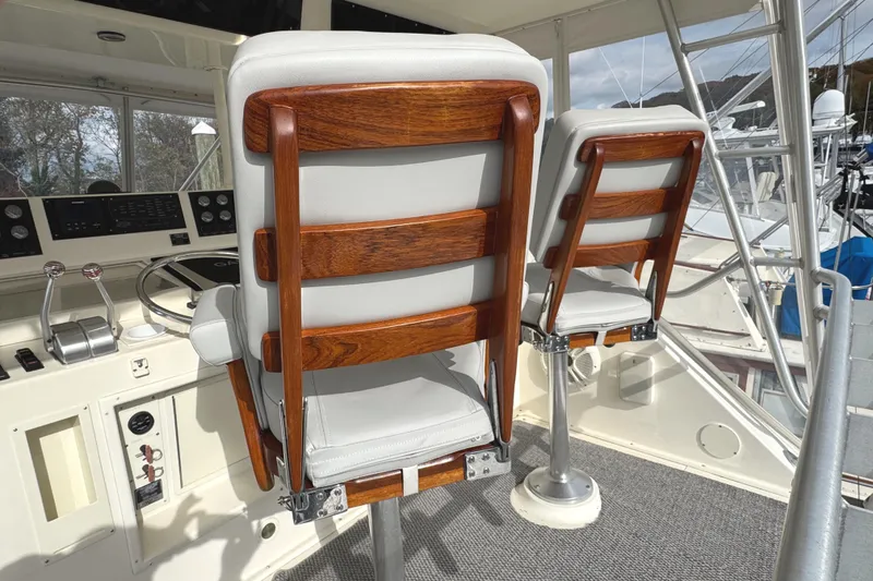 Slide: The Image of Helm of 1991 Viking 53 Convertible yacht with modern controls and comfortable seating. - 17
