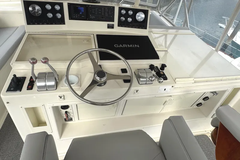 Slide: The Image of Captain's chairs on 1991 Viking 53 Convertible yacht, docked at marina. - 18