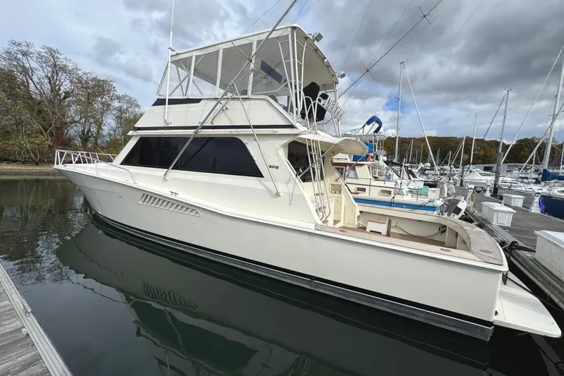 Slide: The Image of 1991 Viking 53 Convertible yacht "Temperance" docked at night in Huntington, NY. - 2