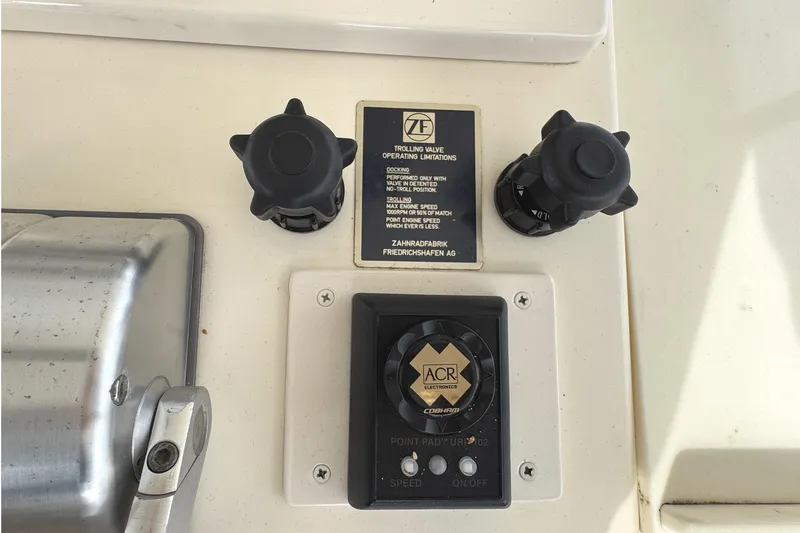 Slide: The Image of Interior view of 1991 Viking 53 Convertible yacht with spacious seating and scenic marina backdrop. - 22