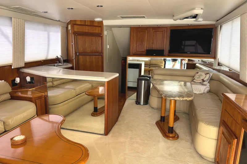 Slide: The Image of 1991 Viking 53 Convertible boat interior with sleek gray seating and modern design. - 26